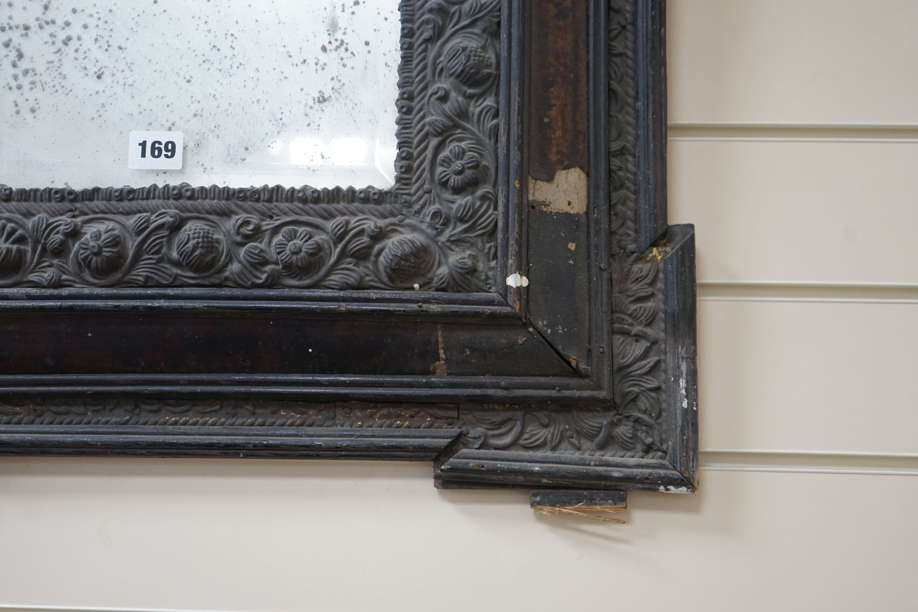 A 19th century Dutch brass and tortoiseshell wall mirror, width 58 cms, height 90 cms.